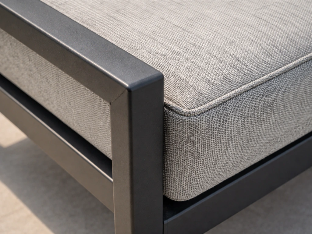 Close-up of powder-coated welded aluminum frame joints next to an Olefin-like cushion fabric texture